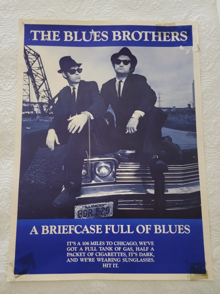 The Blues Brothers Movie Poster
A Briefcase Full of Blues
It's a 106 miles to Chicago, we've got a full tank of gas, half a packet of cigarettes, it's dark, and we're wearing sunglasses.  Hit it.
Jake and Elwood Blues
John Belushi
Dan Akroyd
Illinois license plate BDR529