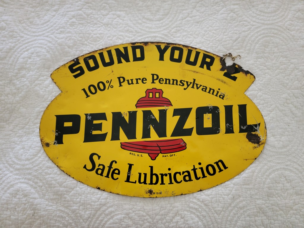 Vintage Pennzoil sign with yellow background, featuring the slogan 'SOUND YOUR Z' and '100% Pure Pennsylvania Pennzoil Safe Lubrication'.
Hanging sign
Side #1