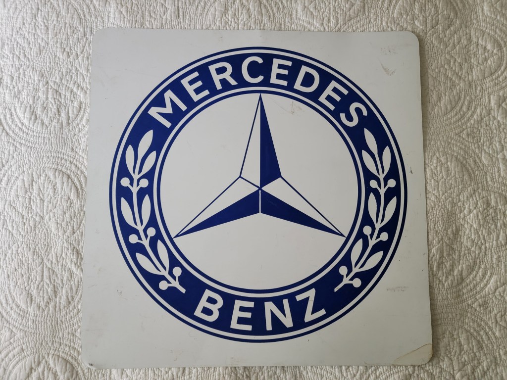 Logo of Mercedes-Benz featuring a three-pointed star surrounded by a circular border with the words 'MERCEDES' and 'BENZ'.
double sided mercedes benz sign